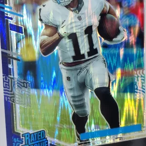 Panini Donruss Optic Football 2023 | #261 Tre Tucker | Las Vegas Raiders | Rated Rookie Purple Shock Prizm | Game Over Sports Cards site de vente de cartes à collectionner NFL Football Américain